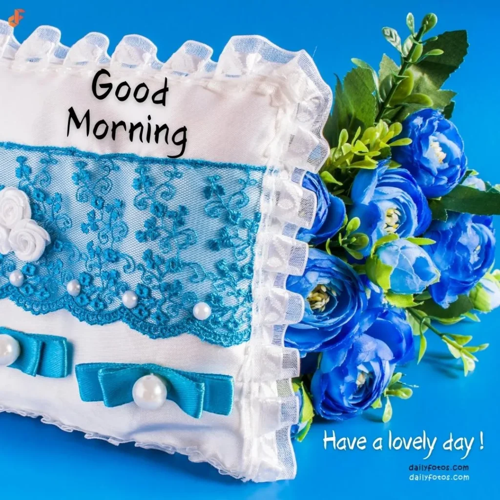 White pillow and blue roses good morning image